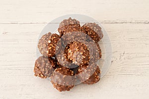 A Pile Of Nutty Chocolate Ice Cream Balls on Course White painted Boards