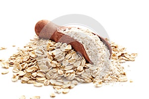 Pile of oat wholegrain flour in spoon