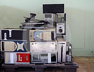 Pile of obsolete used computer case on the palette. It is the enclosure that contains most of the components of a computer Cases.