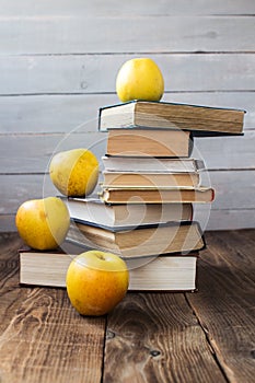 Pile of old books and apples