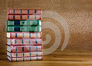 Pile of old books on beautiful wooden table