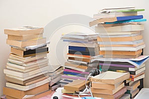 Pile old books on table