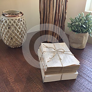 Pile of old books on wooden table