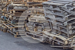 Pile of old and broken wooden pallets