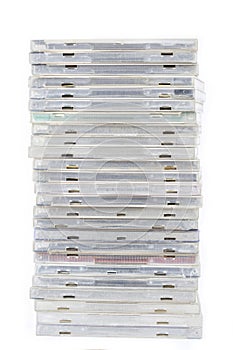 Pile of old compact disc box cd or dvd on white background isolated.