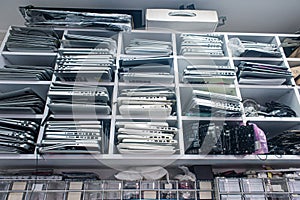 Pile of old laptops in electronics repair and maintenance shop