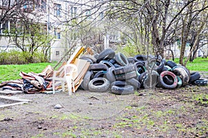 Pile of old multicolored car tires dug in playgrounds. Multicolor used tires. various sizes colored tires. Garbage on the street
