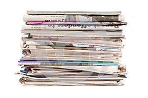 Pile of old newspapers and magazines, stack, side view, isolated on white background