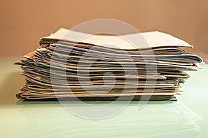 Pile of old newspapers on transparent table - Image