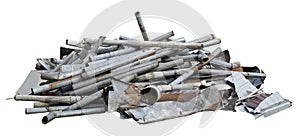 A pile of old rain pipes on garbage dump isolated