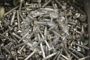 A pile of old screws, nuts and other junk.