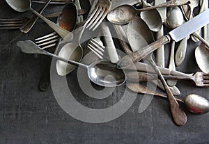 Pile of old tarnished silverware