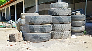 Pile of old tires neatly arranged.