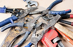 Pile of old tools for construction and repair of plumbing