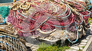 Pile of old and used fishing nets colored.