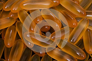 Pile of omega 3 and vitamin d capsules