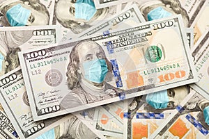 Pile of One Hundred Dollar Bills With Medical Face Mask on Face of Benjamin Franklin