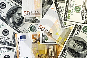 A pile of one hundred dollars USD and fifty euros EUR background close. Money and financial concept