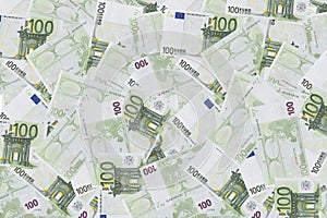 Pile of one hundred euro banknotes isolated on white background.