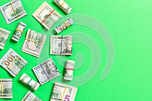 Pile of one hundred US Dollar Bills money on colored background top wiev with copy space for your text in financial concept