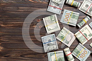 Pile of one hundred US Dollar Bills money on colored background top wiev with copy space for your text in financial concept