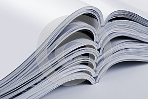 Pile of open blank magazines