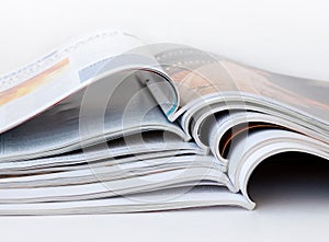 Pile of open magazines
