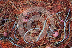 Pile orange fishing net