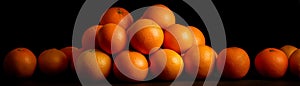 A Pile of Oranges, Black Background, Fruit Concept