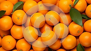 A pile of oranges with leaves