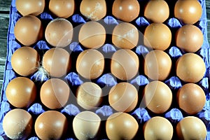 Pile of organic brown fresh and raw hen chicken eggs, stack of eggs isolated and ready to be cooked in various cuisines, selective