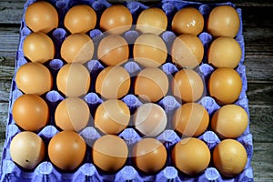 Pile of organic brown fresh and raw hen chicken eggs, stack of eggs isolated and ready to be cooked in various cuisines, selective