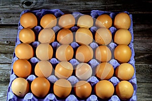 Pile of organic brown fresh and raw hen chicken eggs, stack of eggs isolated and ready to be cooked in various cuisines, selective