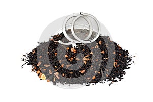 Pile of organic chai tea with pumpkin and infuser ball