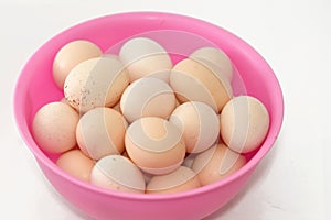 Pile of organic fresh and raw hen chicken eggs, stack of eggs isolated and ready to be cooked in various cuisines, selective focus