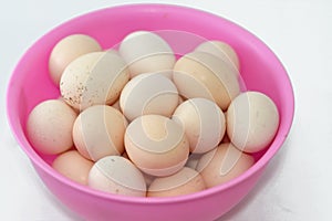 Pile of organic fresh and raw hen chicken eggs, stack of eggs isolated and ready to be cooked in various cuisines, selective focus