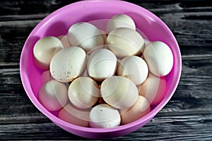 Pile of organic fresh and raw hen chicken eggs, stack of eggs isolated and ready to be cooked in various cuisines, selective focus