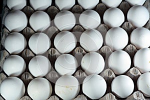 Pile of organic fresh and raw hen chicken eggs, stack of eggs isolated and ready to be cooked in various cuisines, selective focus