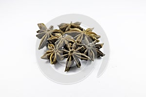 Pile of organic fresh whole star anise isolated on white background. close up.top view