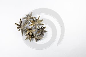 Pile of organic fresh whole star anise isolated on white background. close up.top view