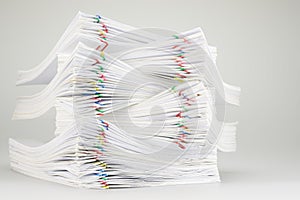 Pile overload of document with colorful paper clip