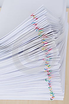 Pile overload document reports place horizontal with colorful paper clip