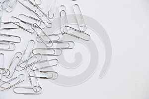 Pile of paper clips on white background
