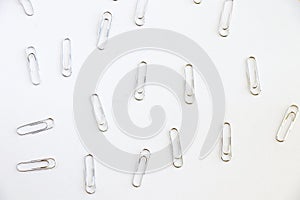 Pile of paper clips on white background