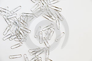 Pile of paper clips on white background