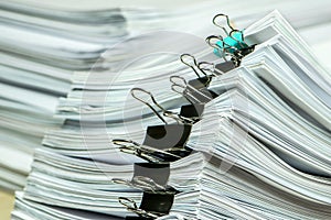 pile of paper documents in the office