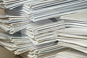 Pile of paper documents in the office. waste paper, paper trash