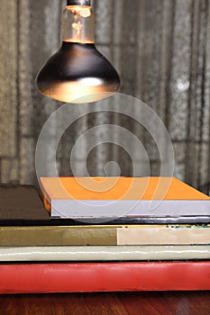 Pile of paperback books and novels on a table