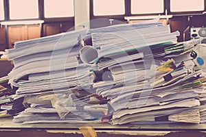 Pile of papers laid overlap on the desk