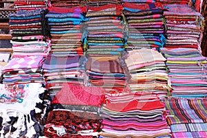 Pile of pashmina scarves for sale